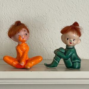 Two Japan Pixies/Elves With red Hair Dressed in Orange Green Sitting Tagged Read